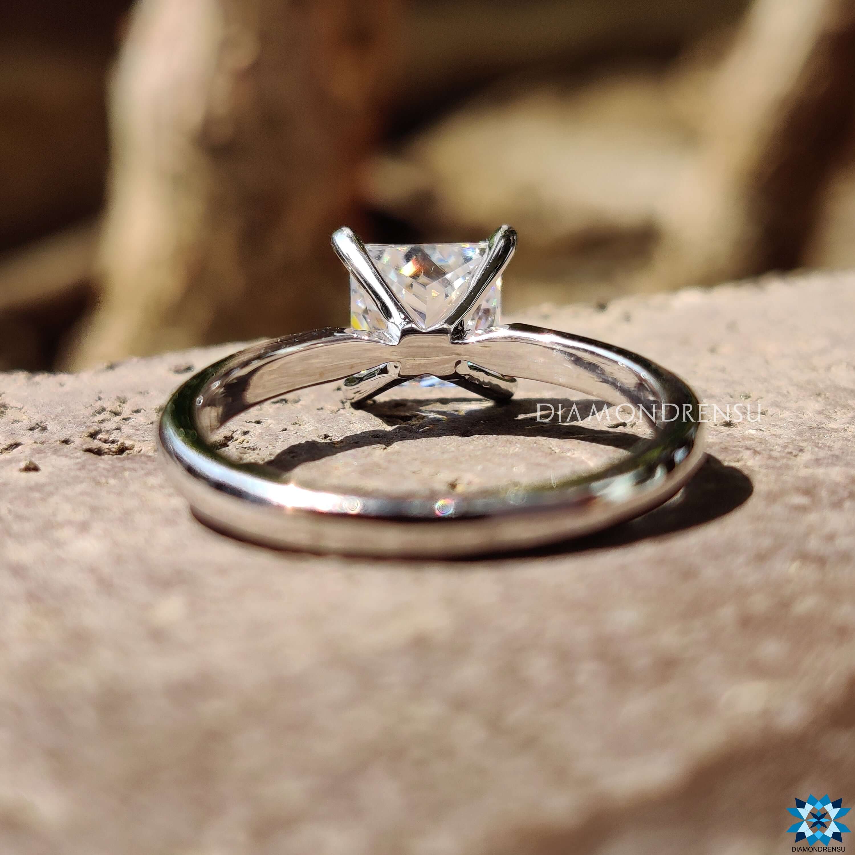 Custom engagement ring with princess moissanite center.