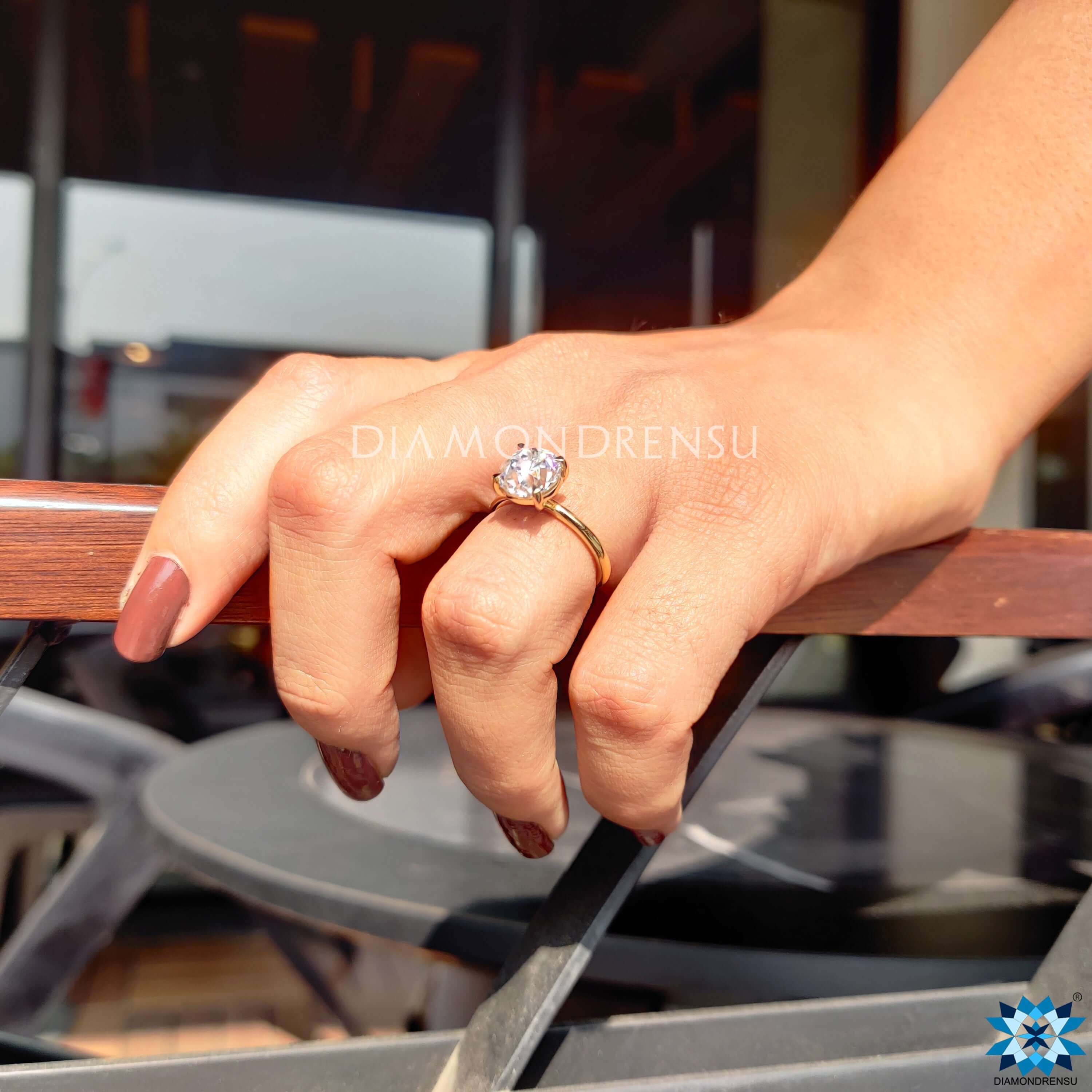 Old European cut engagement ring with 4 claw prong setting.