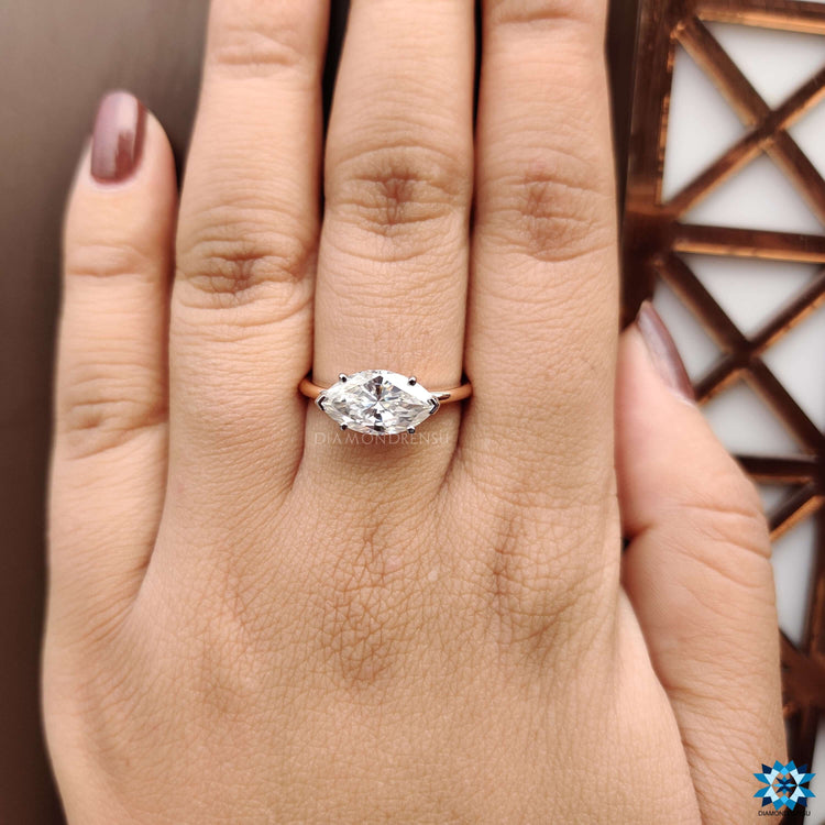 Marquise cut moissanite ring in two-tone white and rose gold.
