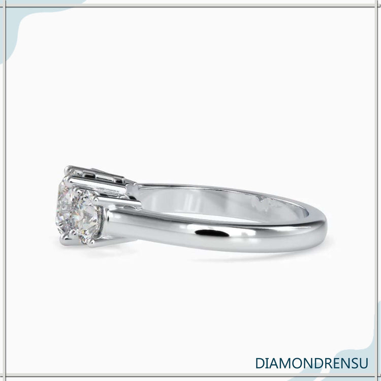 Rose gold engagement ring with round cut centre and two sides.