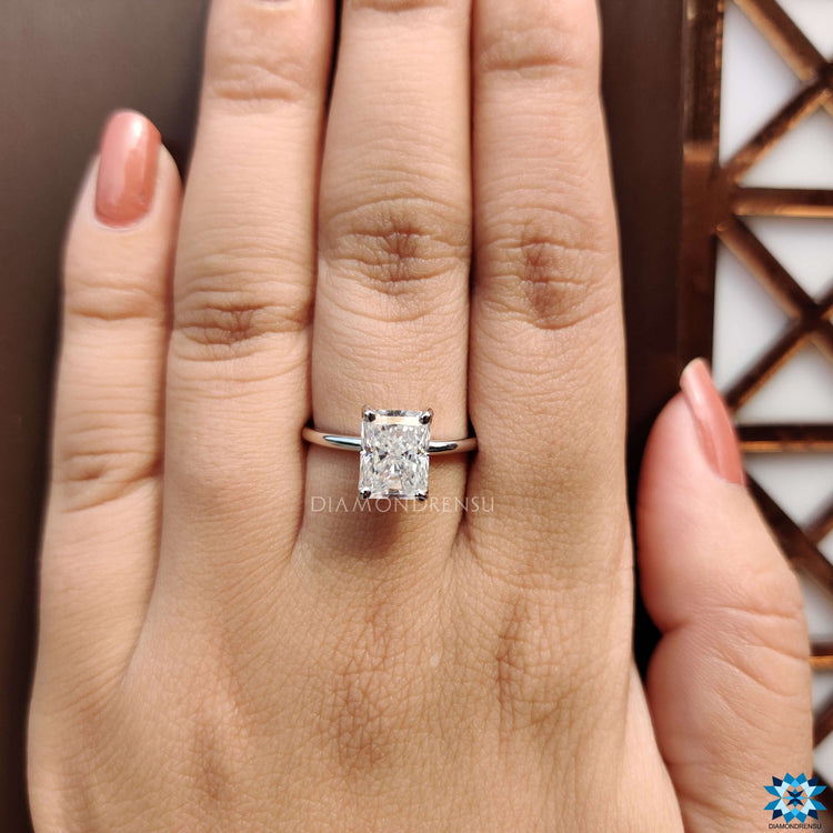 Diamondrensu UK ring designed with radiant moissanite solitaire.