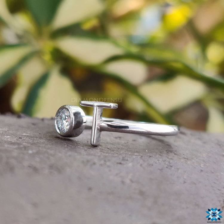 Bezel set moissanite ring with a personalised design and secure setting.