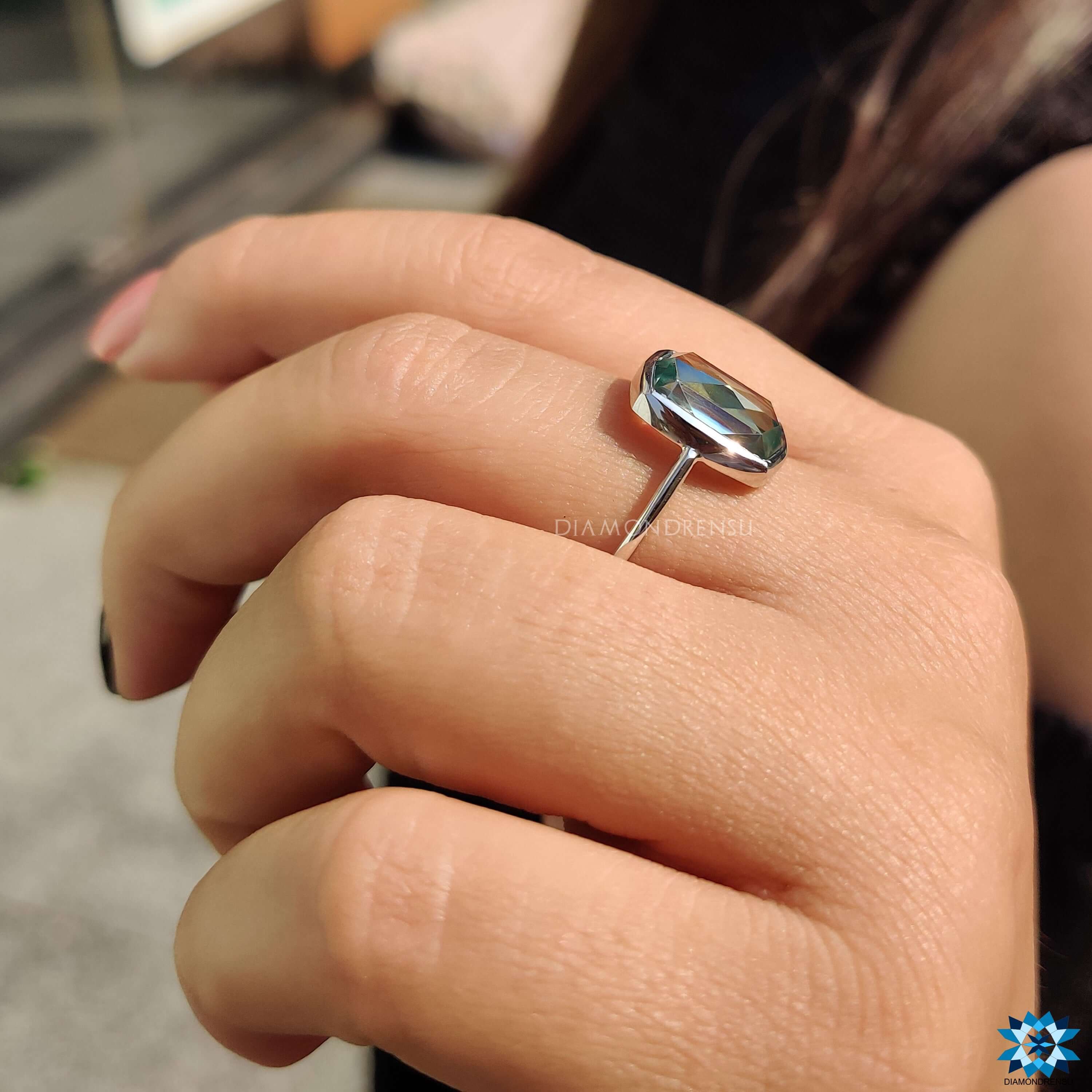 Minimalist engagement ring with cushion rose cut moissanite center.