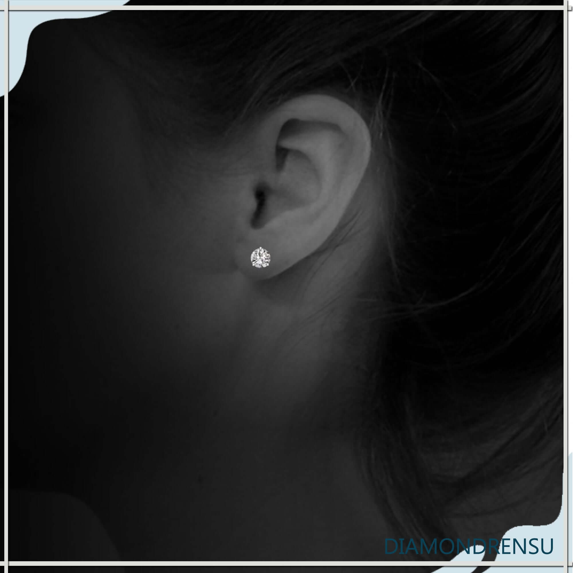 Round diamond earrings in 3 prong stud setting.