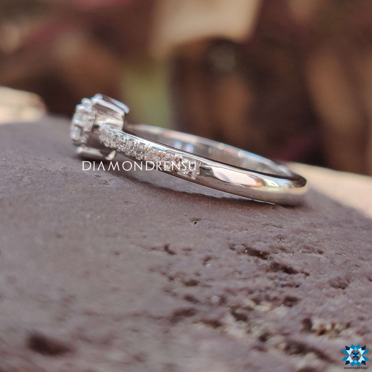 Moissanite halo ring with four prong setting.