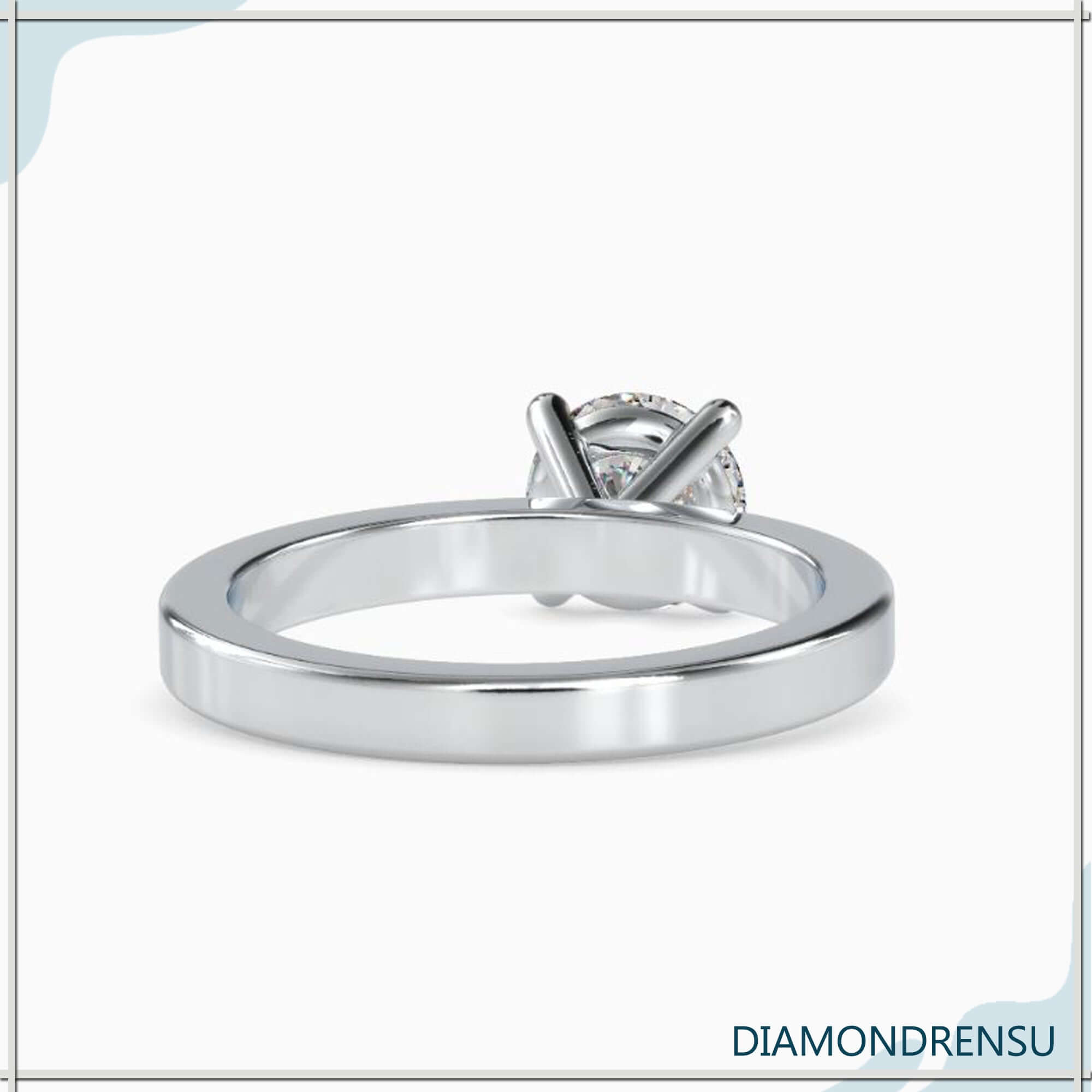 Handmade jewellery ring with round cut diamond solitaire.