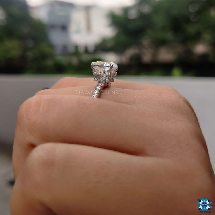 Cushion cut engagement ring in 4 prong setting.