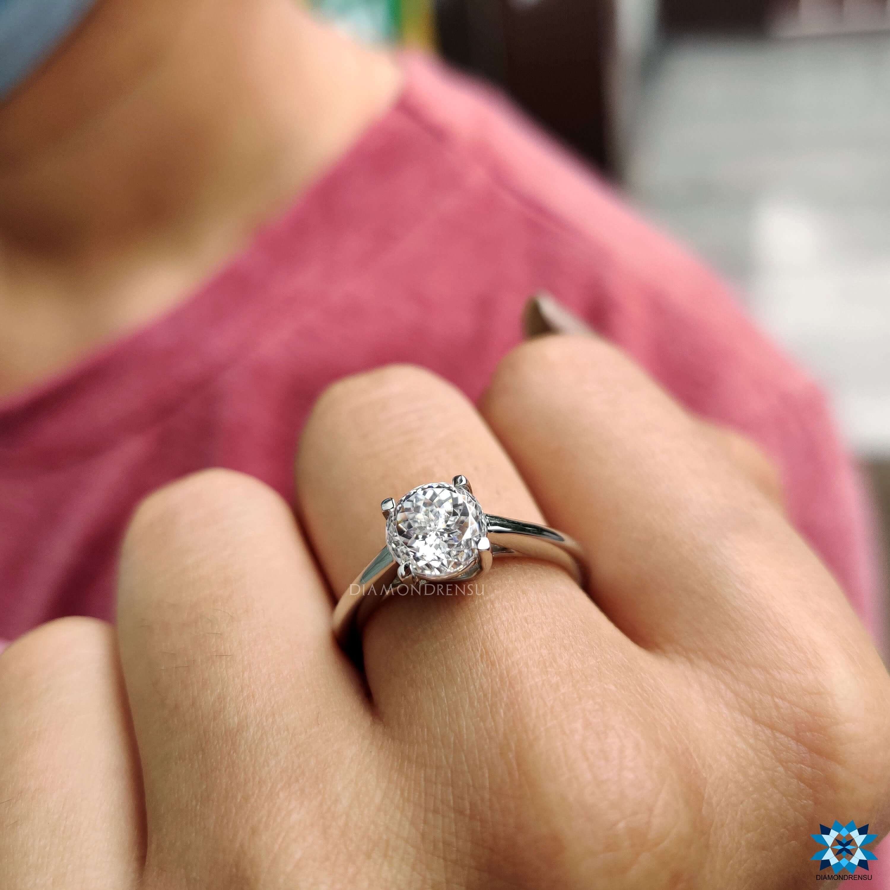 Solitaire engagement ring with Portuguese cut stone.