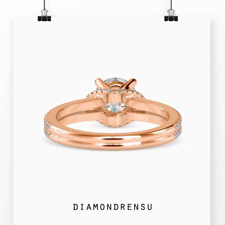 Yellow gold diamond ring with split shank halo design.
