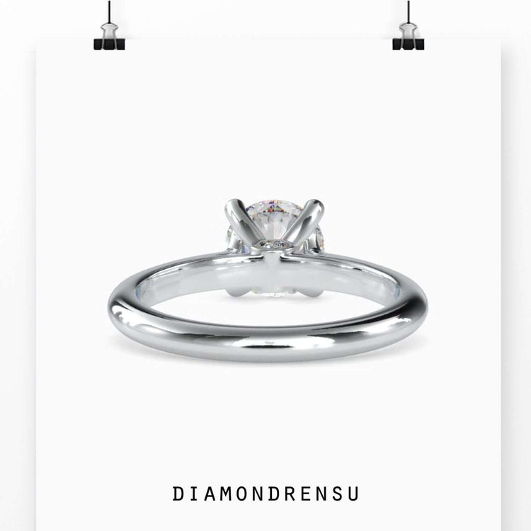 Round prong setting ring with lab grown solitaire diamond.
