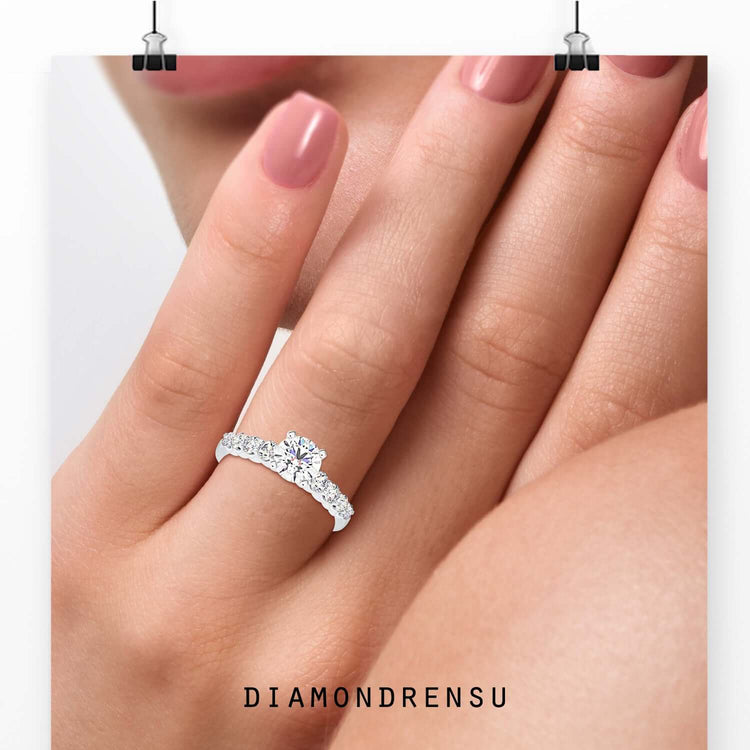 Lab grown diamond ring with pave band and round brilliant cut centre.