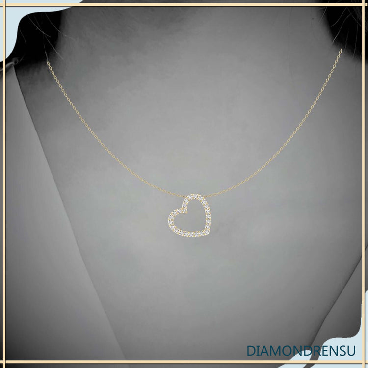Heart shape pendant crafted in white gold with unique design.
