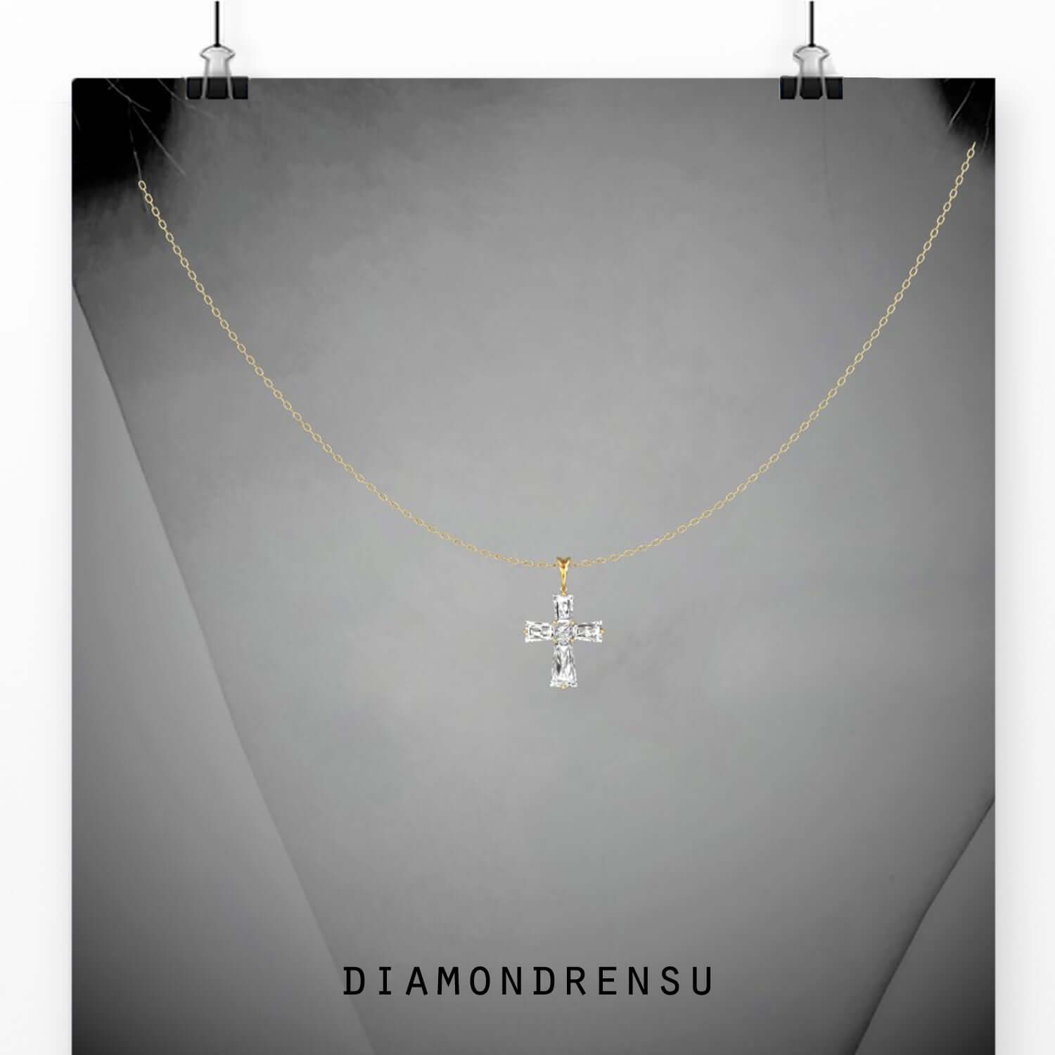 Cross pendant crafted in white gold with prong setting.