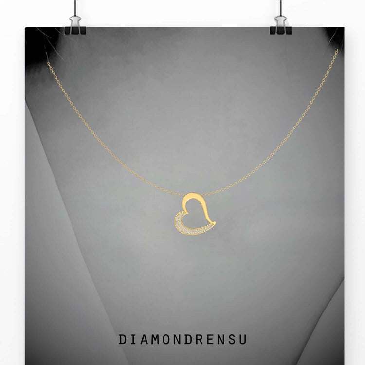Round heart diamond pendant in rose gold finish.