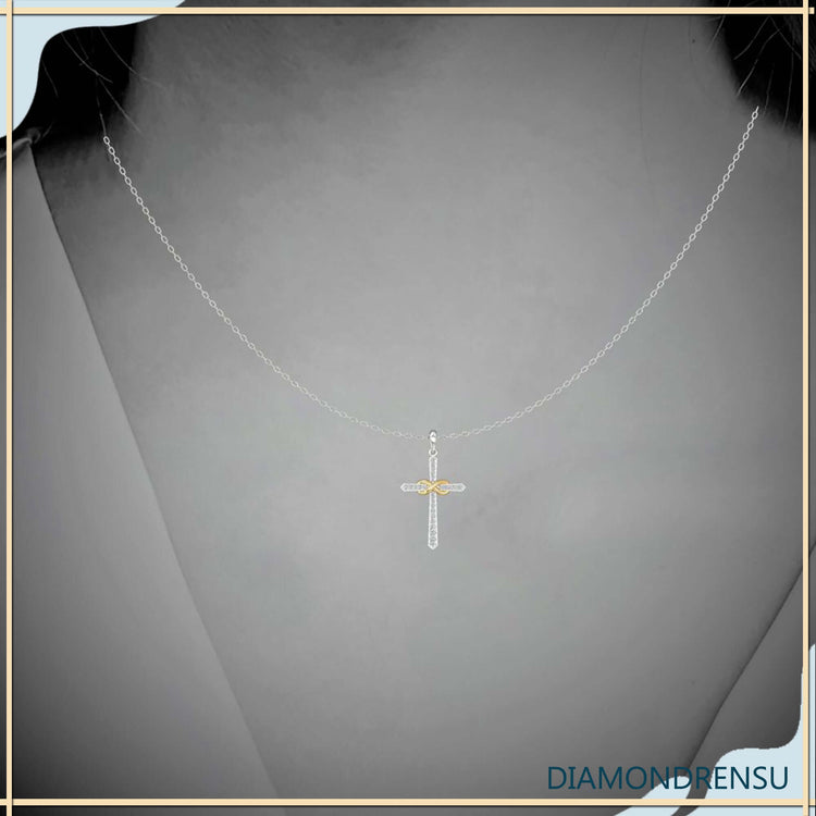 Infinity cross pendant crafted in two tone gold.