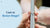 Jeweller measuring engagement ring size on ring mandrel for resizing cost guide