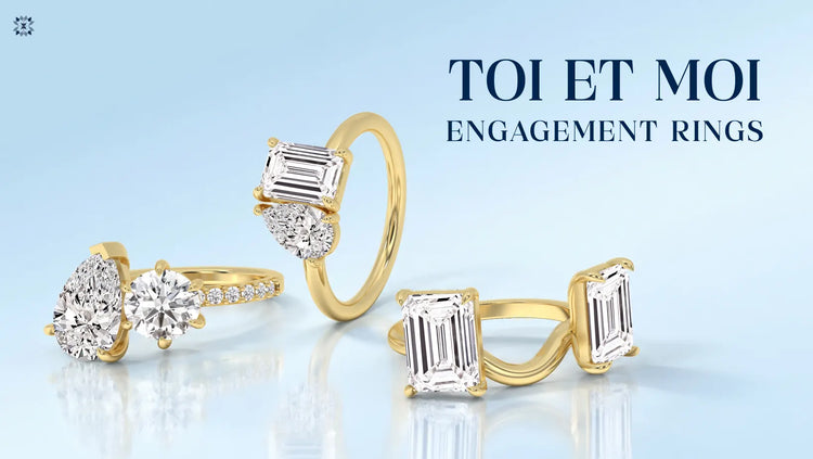 Toi et Moi engagement rings with emerald, pear, and round cut diamonds in gold settings