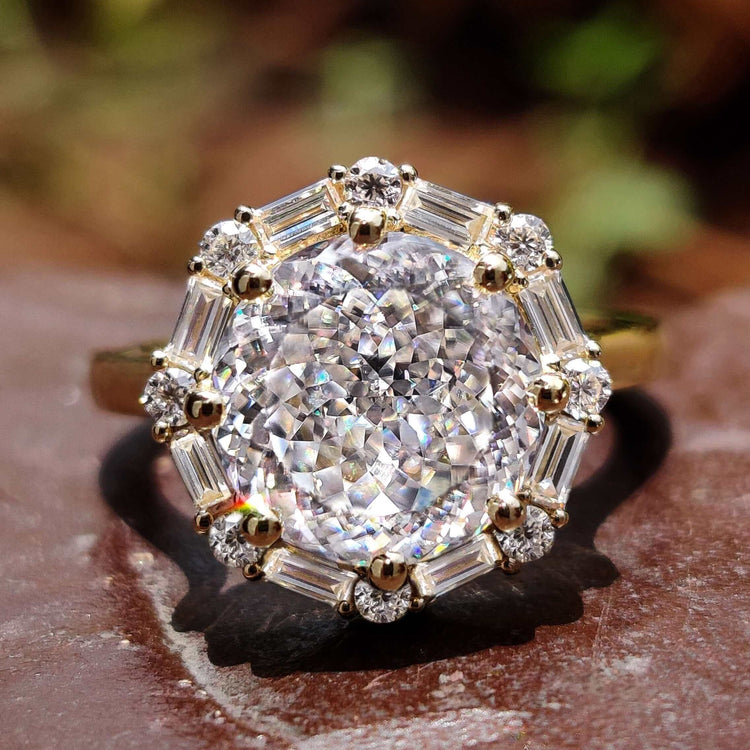 Vintage style engagement ring with Portuguese cut moissanite.
