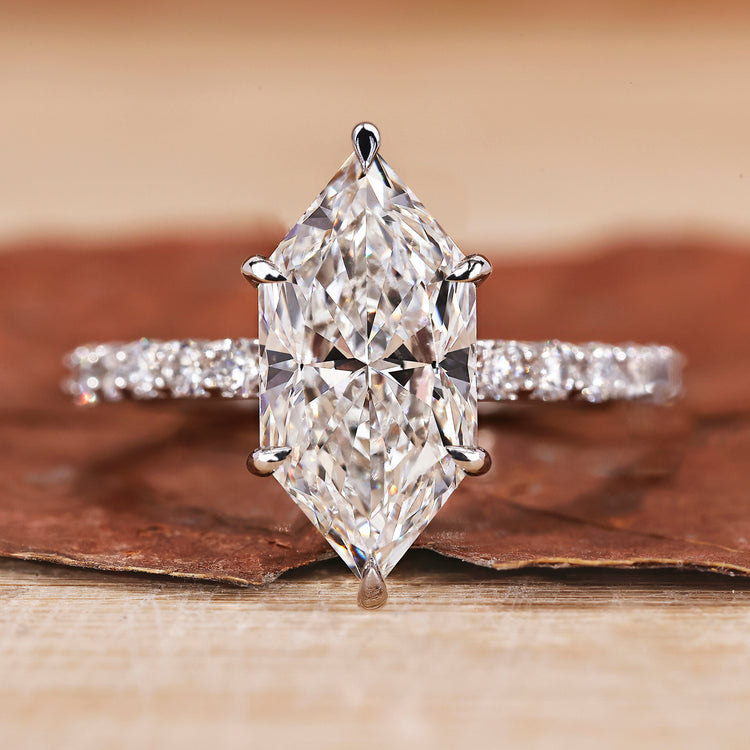 Hidden halo engagement ring with a Dutch marquise diamond.

