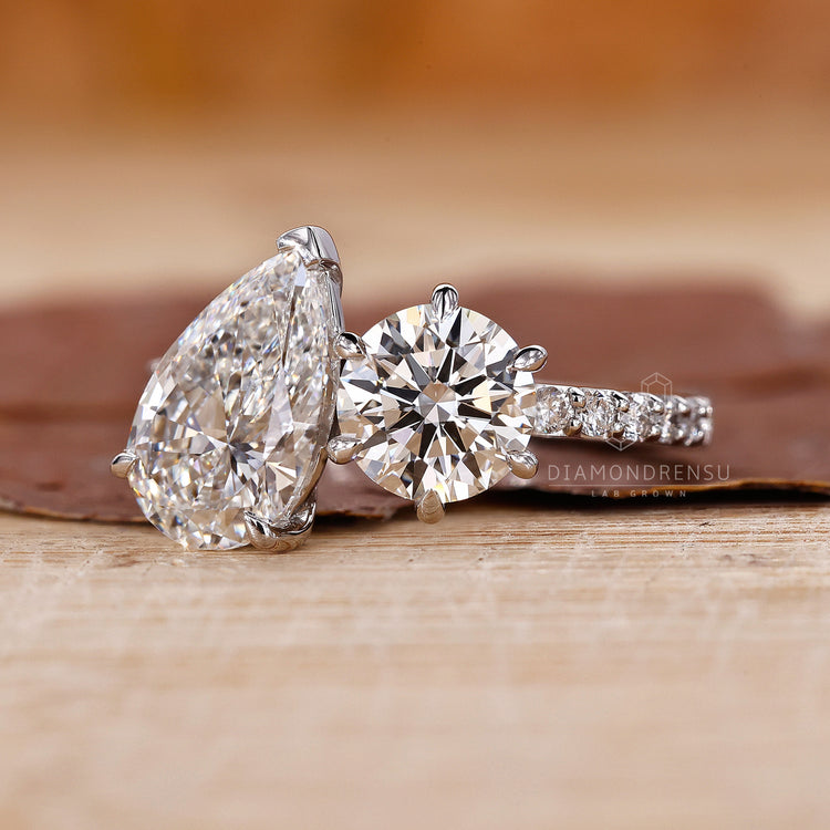 Diamondrensu UK engagement ring with unique two stone design.
