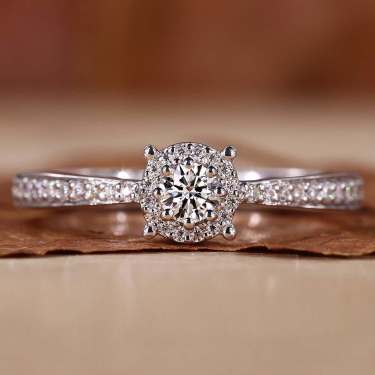 Round diamond engagement ring with a pave setting ring for a timeless design and unmatched brilliance.
