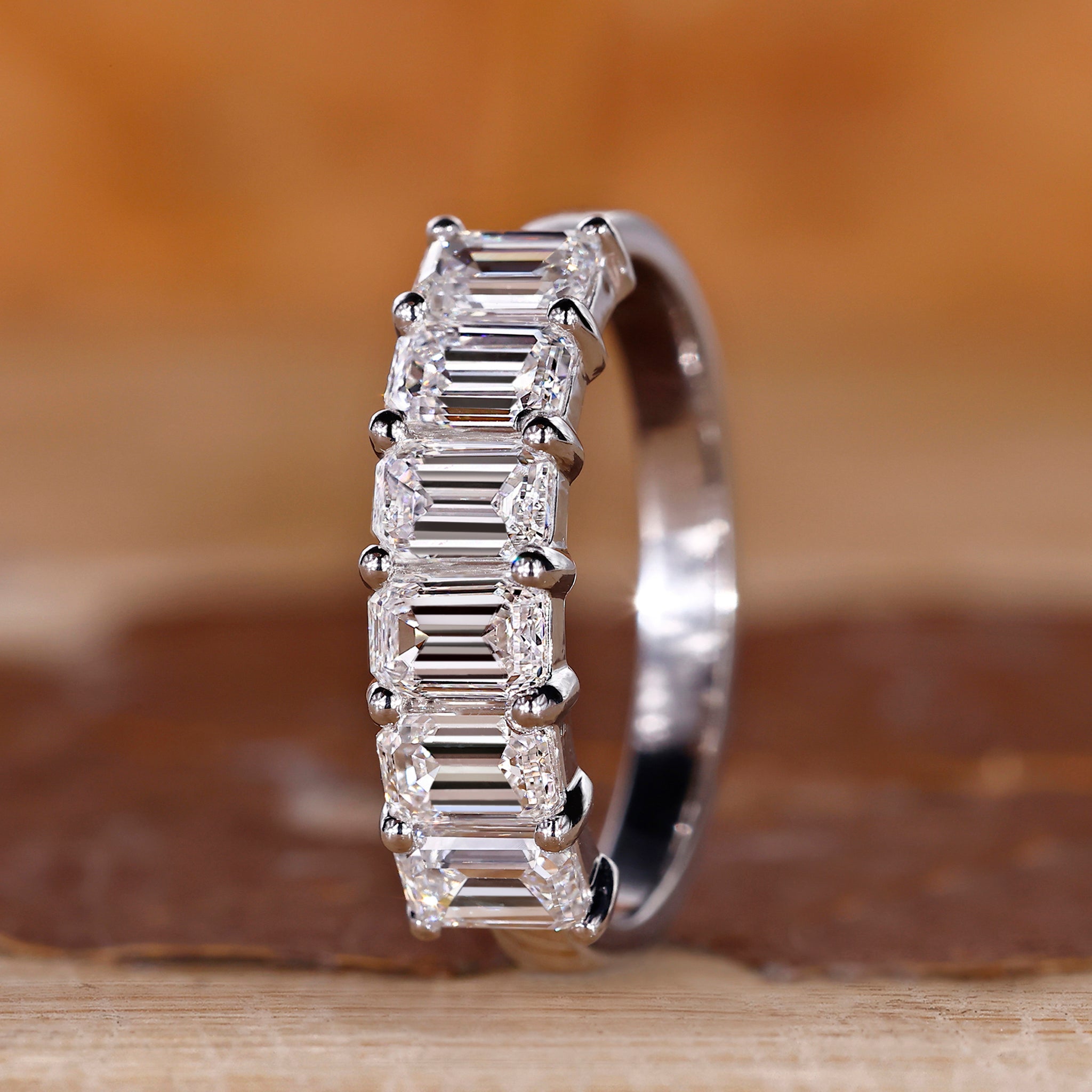 Emerald cut diamond band with a refined finish.
