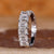 Emerald cut diamond band with a refined finish.
