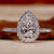 Teardrop engagement ring with pear diamond and elegant design for timeless charm.
