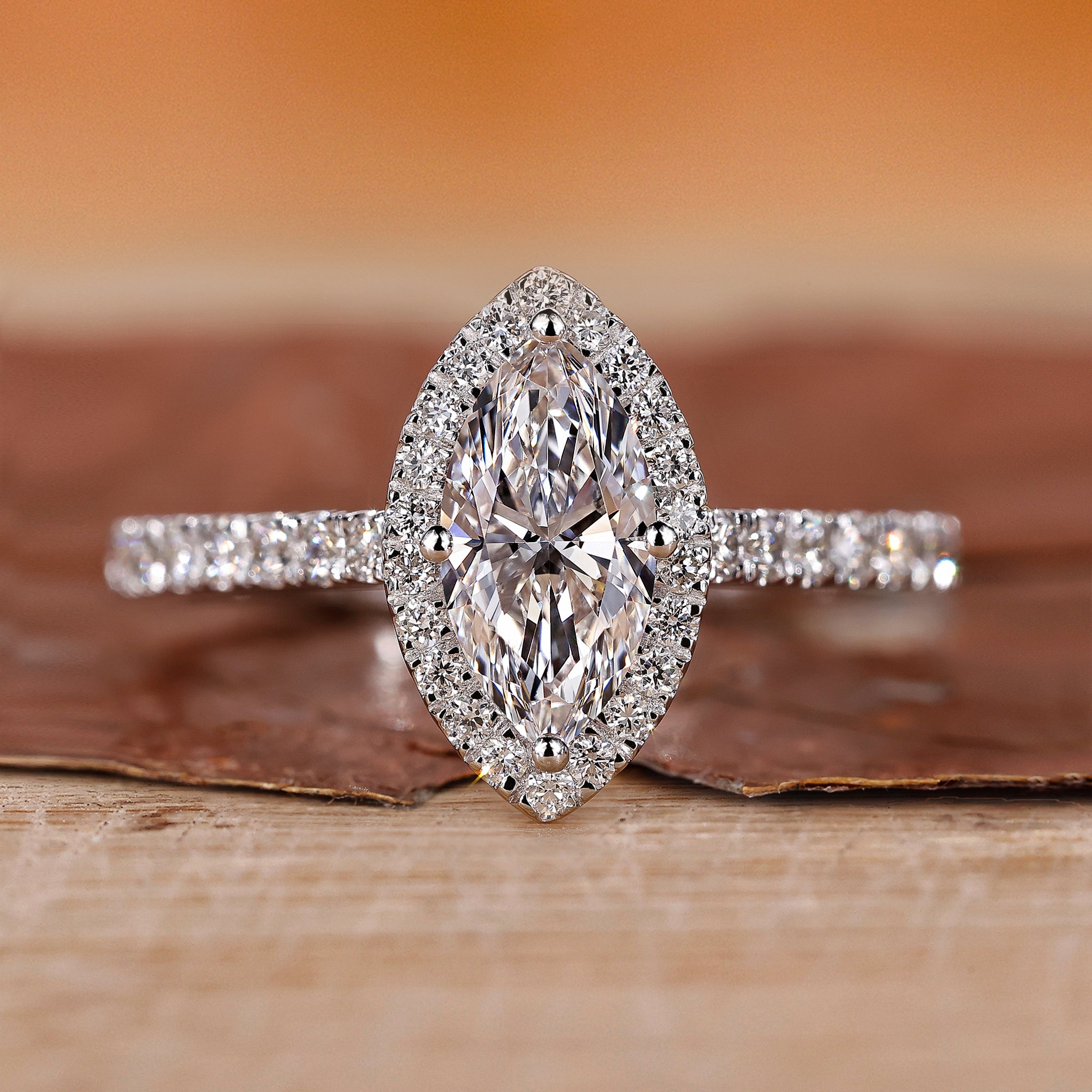 Marquise halo engagement ring in white gold.

