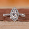 Marquise halo engagement ring in white gold.
