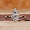 Pear cut diamond ring in a yellow gold setting.

