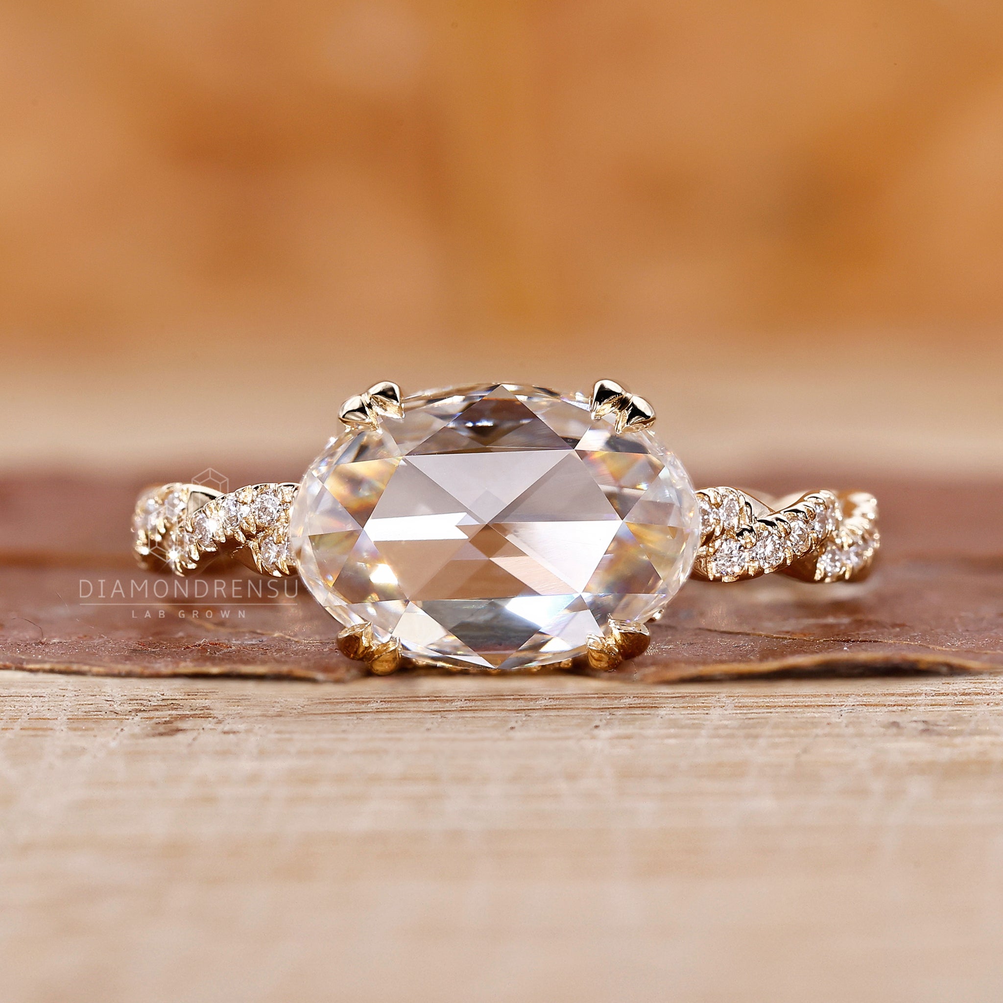 Hidden halo engagement ring with gold oval diamond ring
