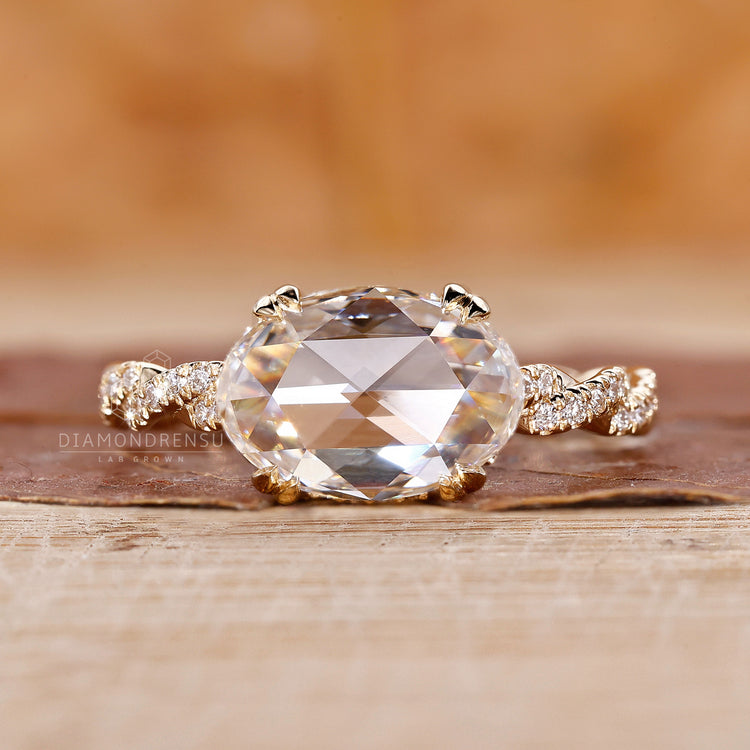 Hidden halo engagement ring with gold oval diamond ring
