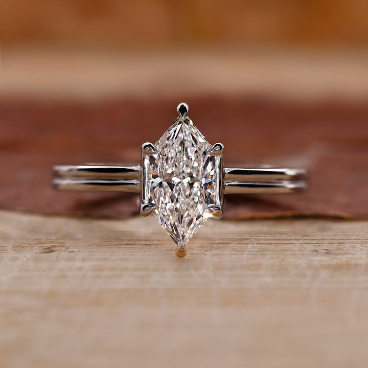 Dutch marquise diamond ring with dual shank setting.
