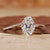 Oval engagement ring with wedding band in yellow gold bridal set.
