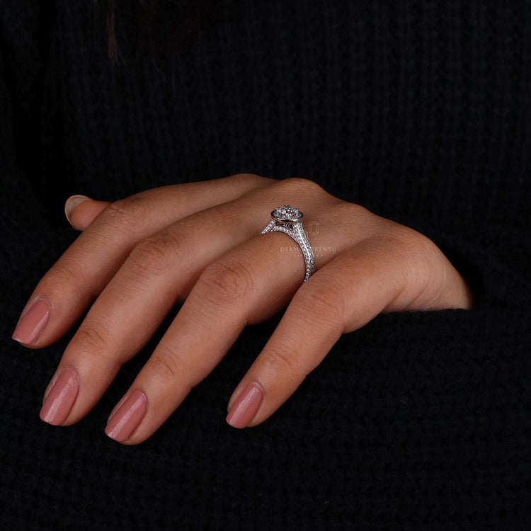 Engagement ring with pave accents featuring a 4 prong diamond ring and round brilliant centre stone.
