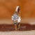 Three stone diamond engagement ring with a balanced design.

