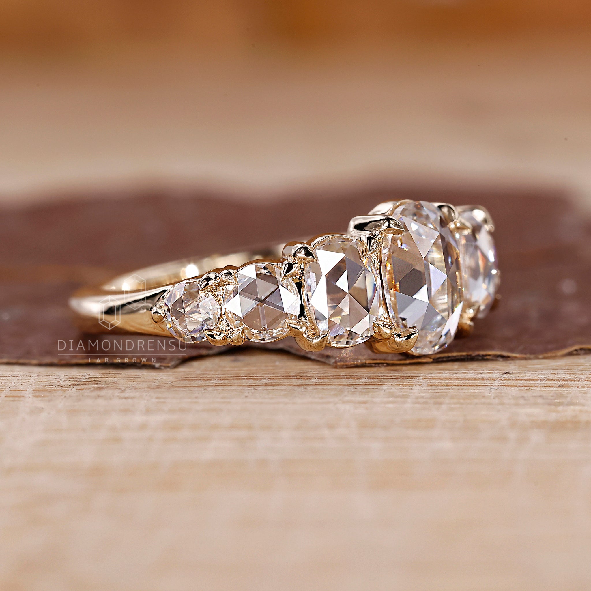 4 prong claw setting holding a rose cut diamond.
