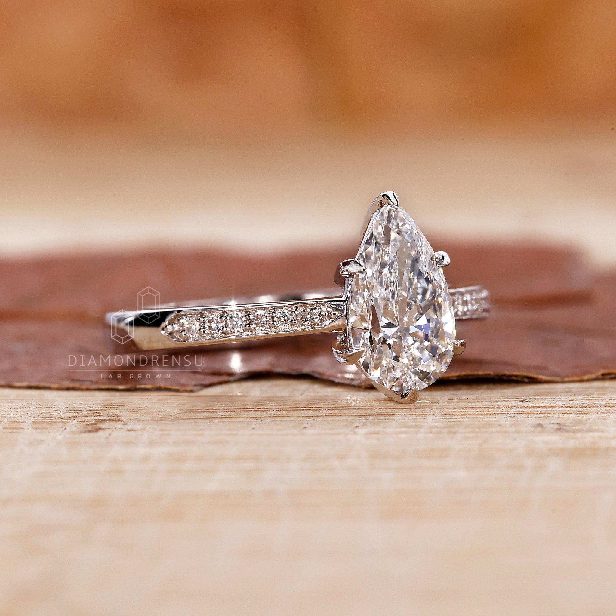 Pave setting shines in white gold engagement ring.
