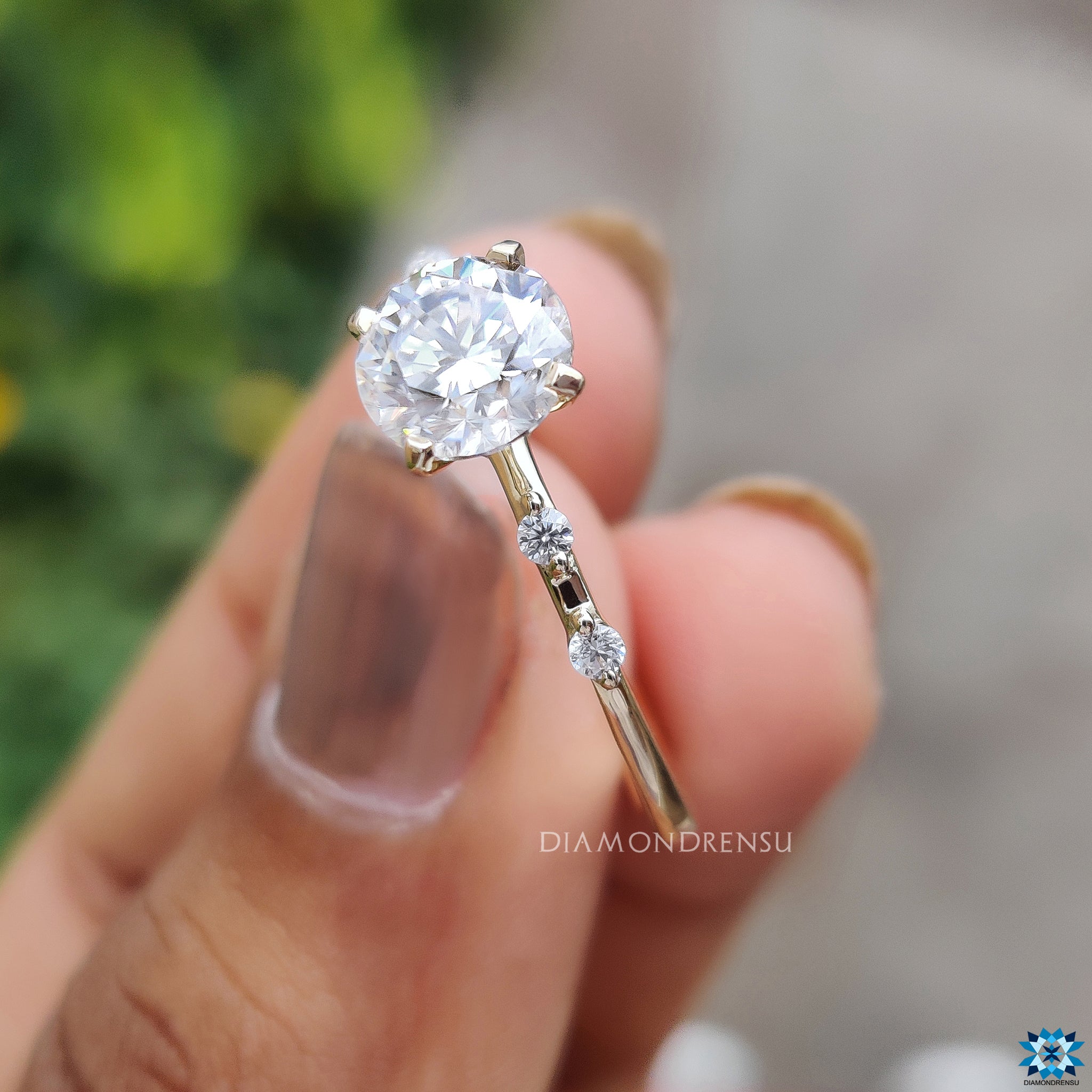 Handmade jewelry ring with round moissanite and distance pave setting.
