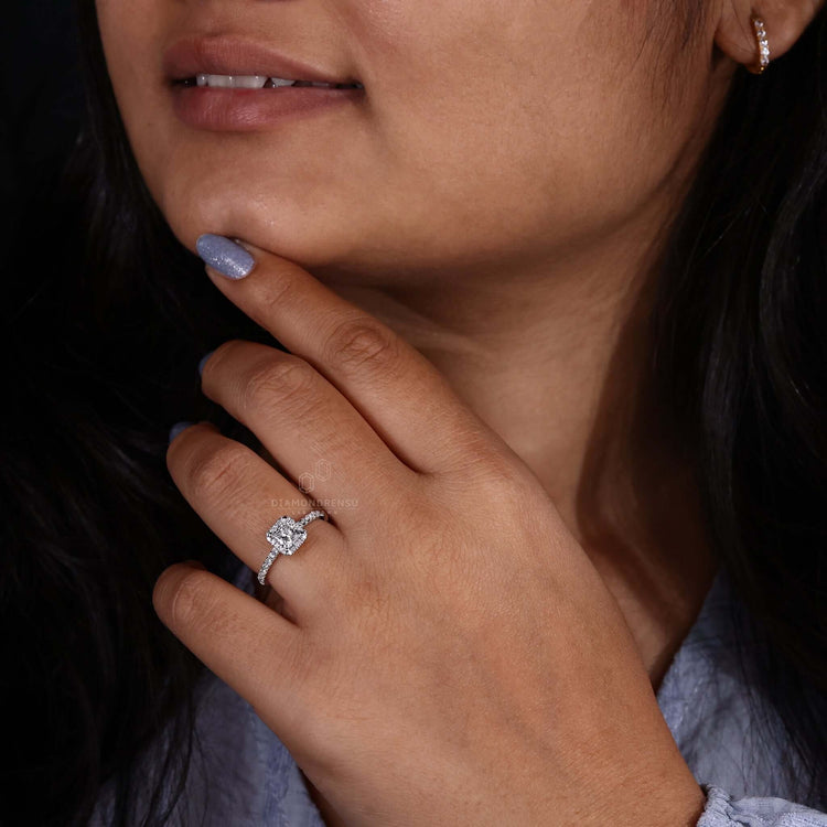 Halo diamond engagement ring with a unique princess cut design.