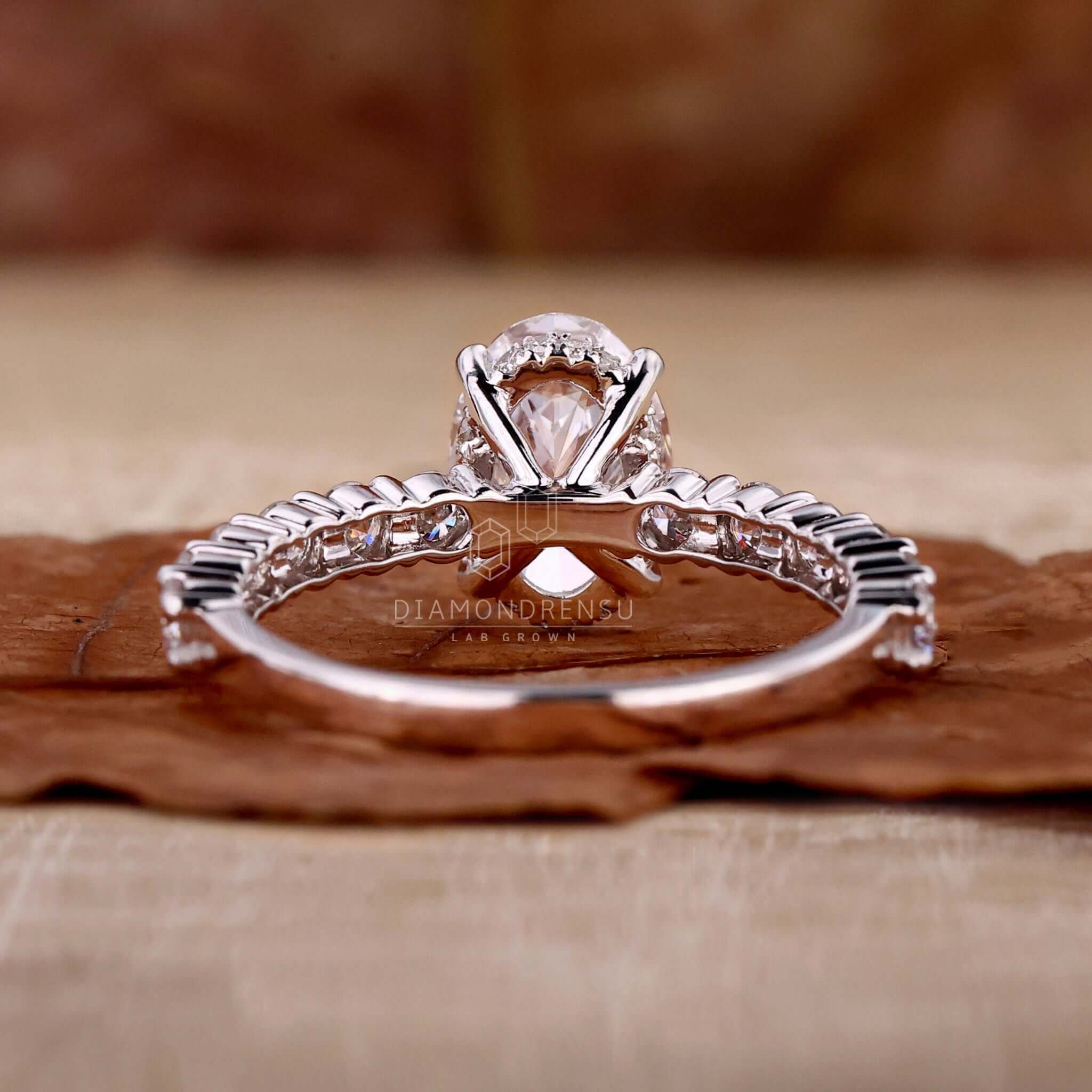 Oval hidden halo engagement ring for a unique and elegant look.