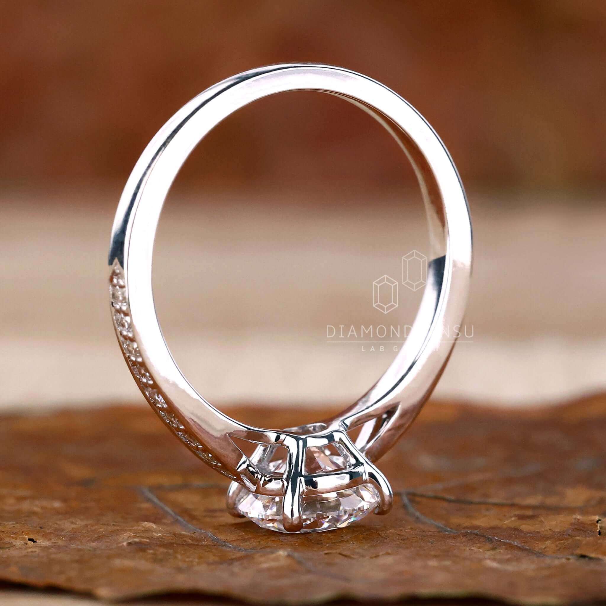 4 prong diamond ring with a tapered pave ring design, ideal for unique engagement ring styles in the UK.