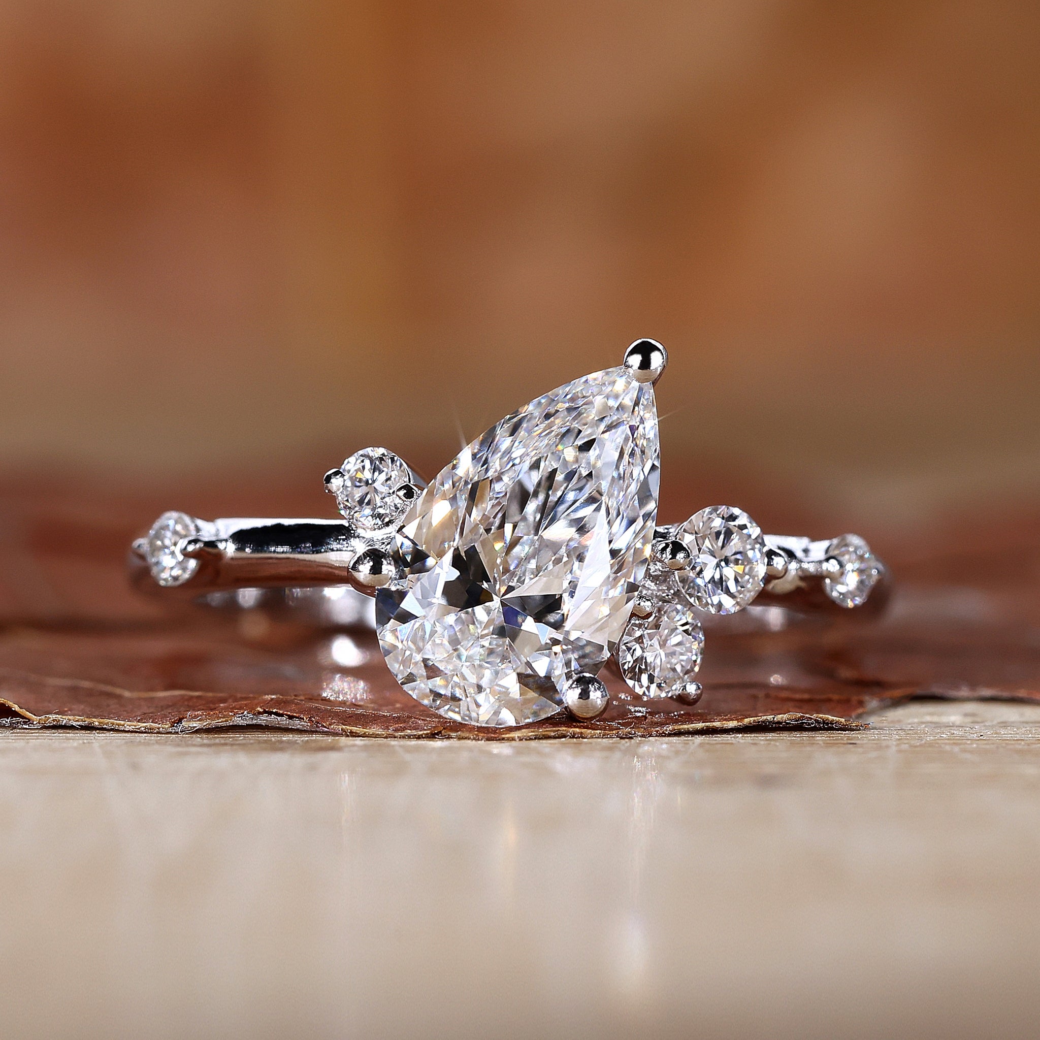 Pear diamond ring in a classic prong setting design.