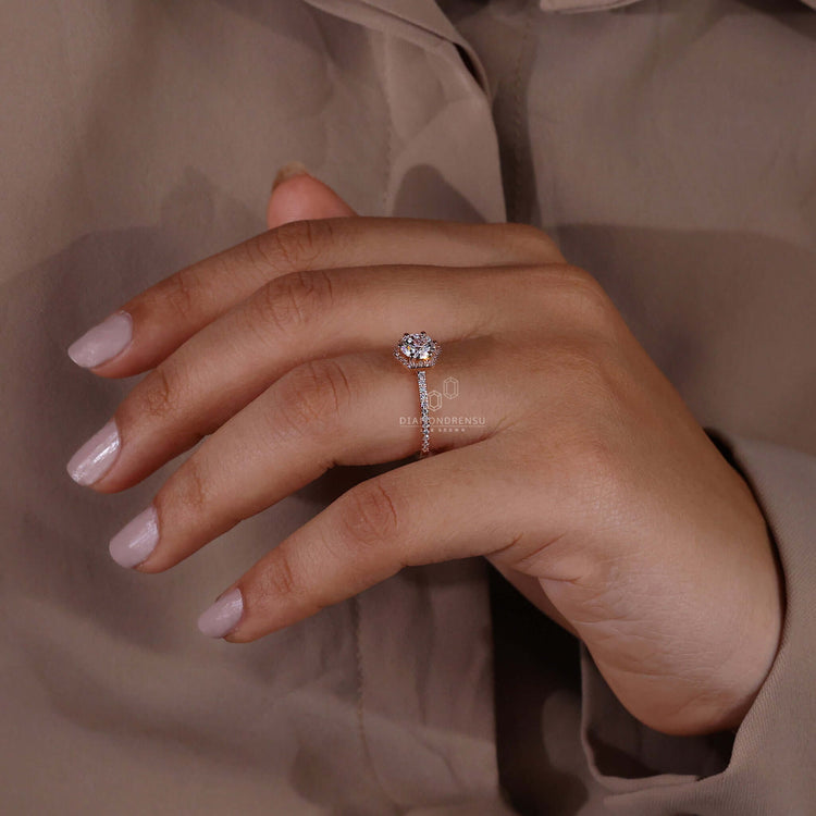 Rose gold ring featuring a halo ring design, handcrafted for UK engagement traditions with igi certified diamonds.