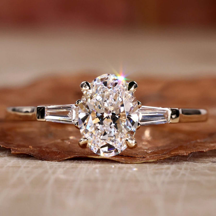 Three stone ring crafted with Lab Grown Diamond, featuring a beautiful oval shaped engagement ring design.
