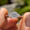 3 stone round engagement ring with round cut moissanite and prongs.
