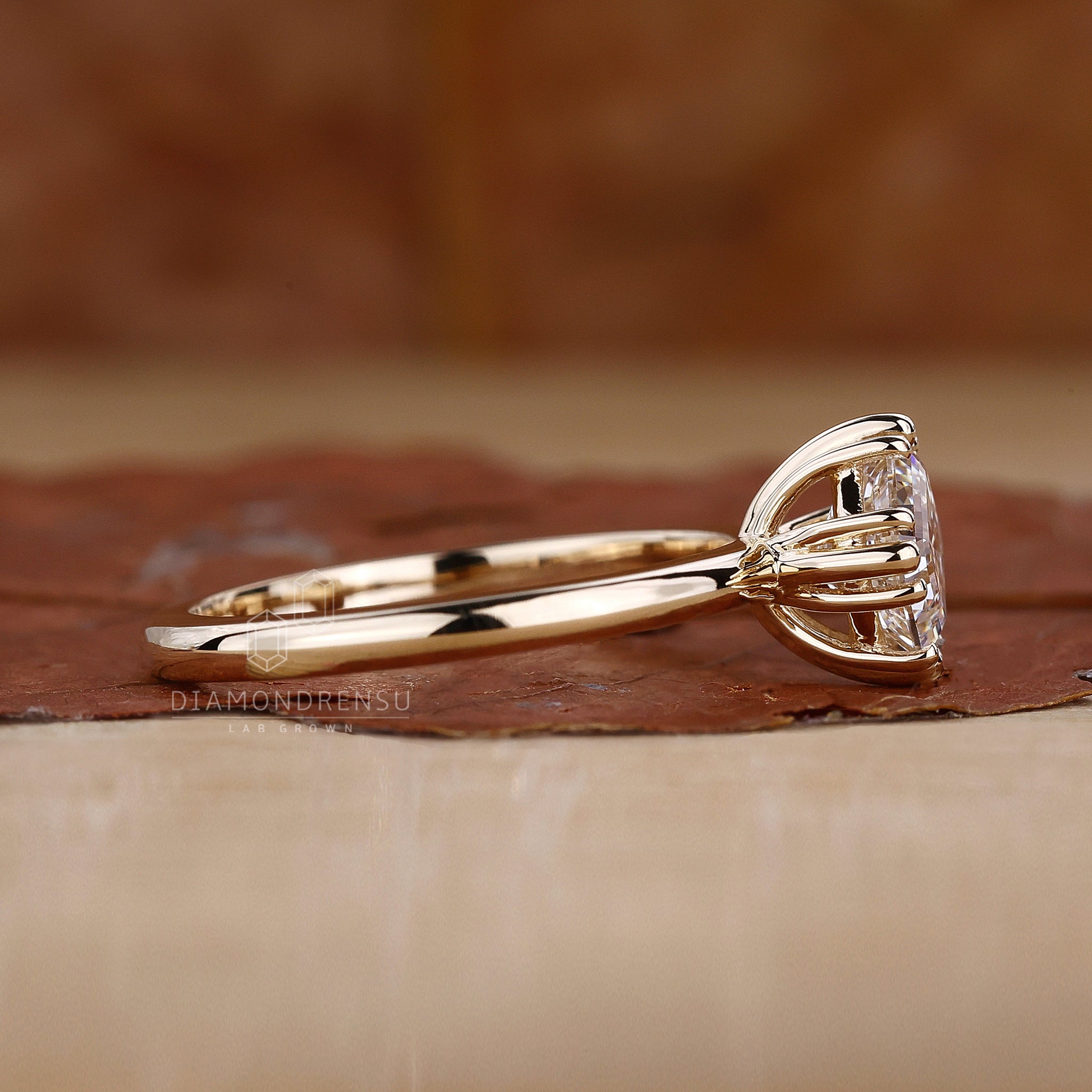 Triple compass prong setting with Asscher cut.
