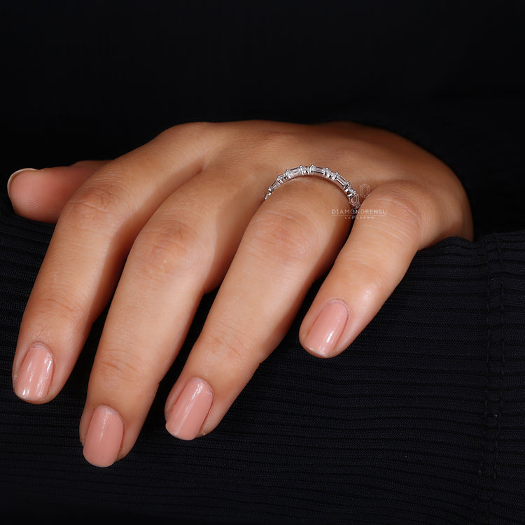 Lab grown emerald cut diamond wedding band.
