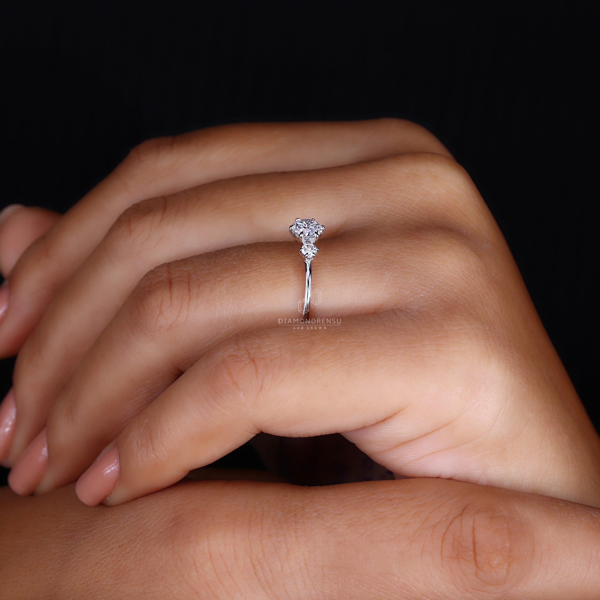 Buy engagement ring with three stone setting.
